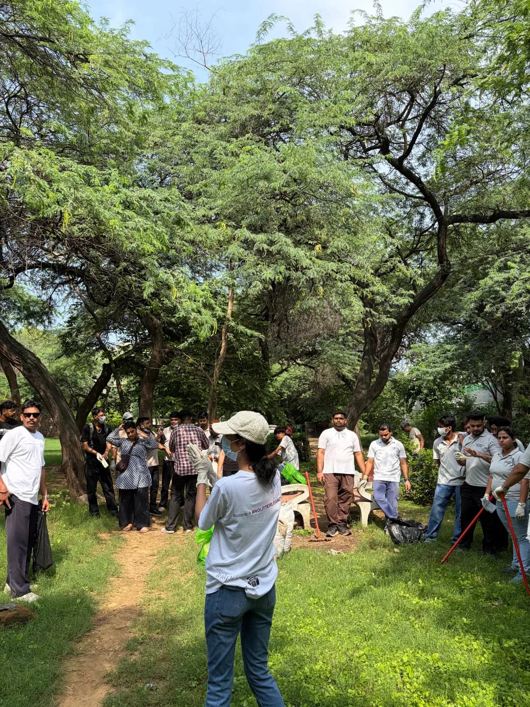 Volunteers at a Heritage Cleanliness Project drive in Delhi — panel 1, photograph 1